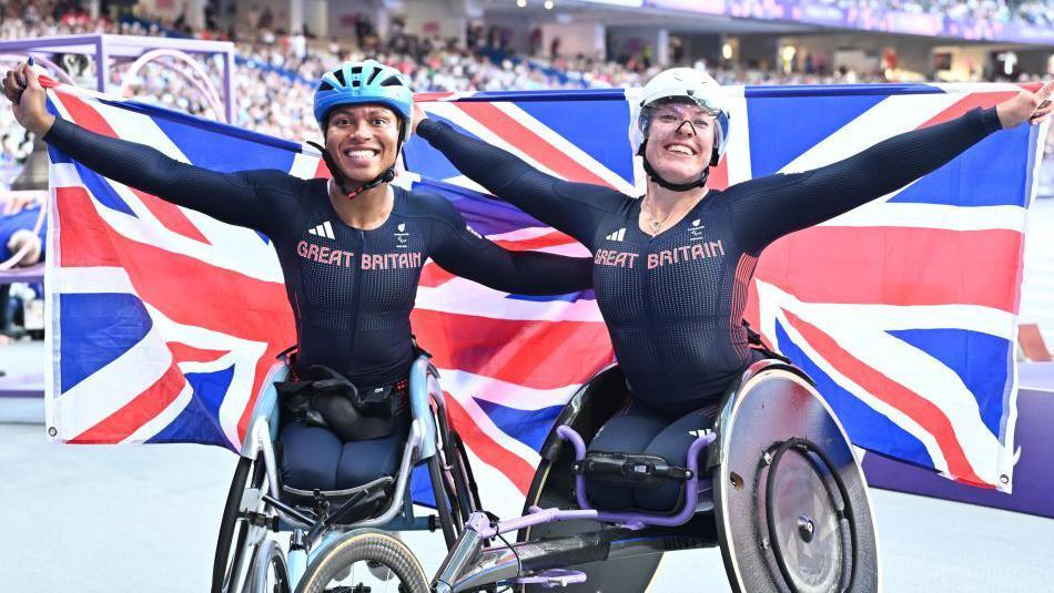 Hannah Cockroft and Kare Adenegan pose with union jack flags