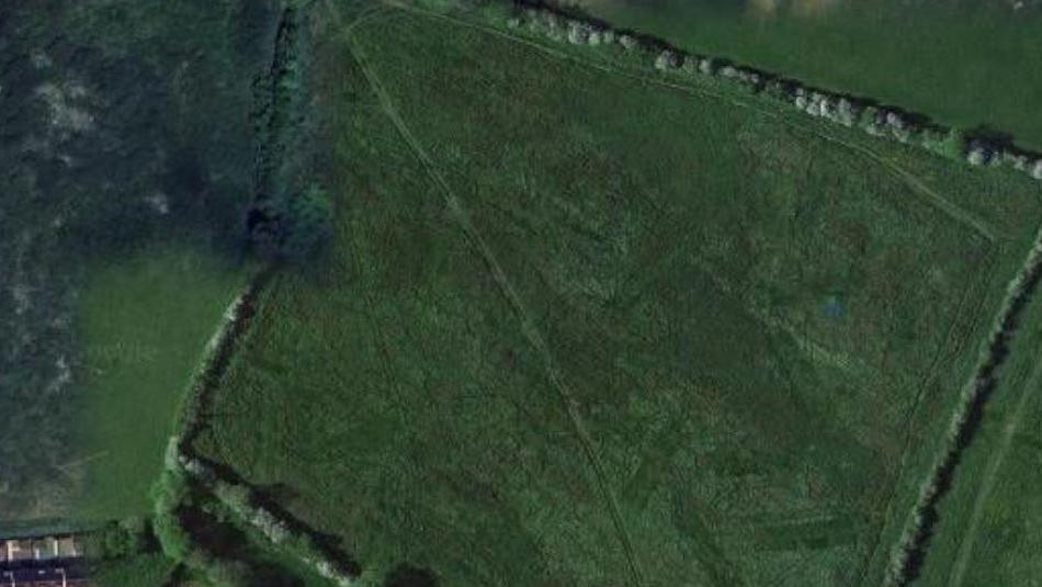 Google satellite image of green fields where the proposed development could be built