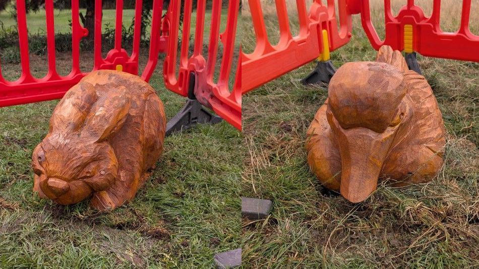 Wooden sculpture of a rabbit and a duck