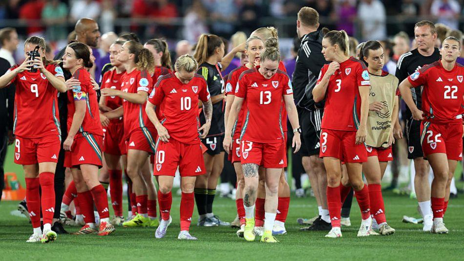 Wales players look dejected following their defeat by England