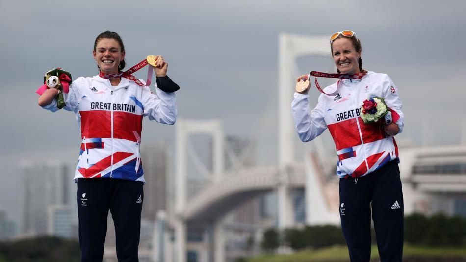 Lauren Steadman and Claire Cashmore with their medals following the women's triathlon at the 2020 Paralympics in Tokyo