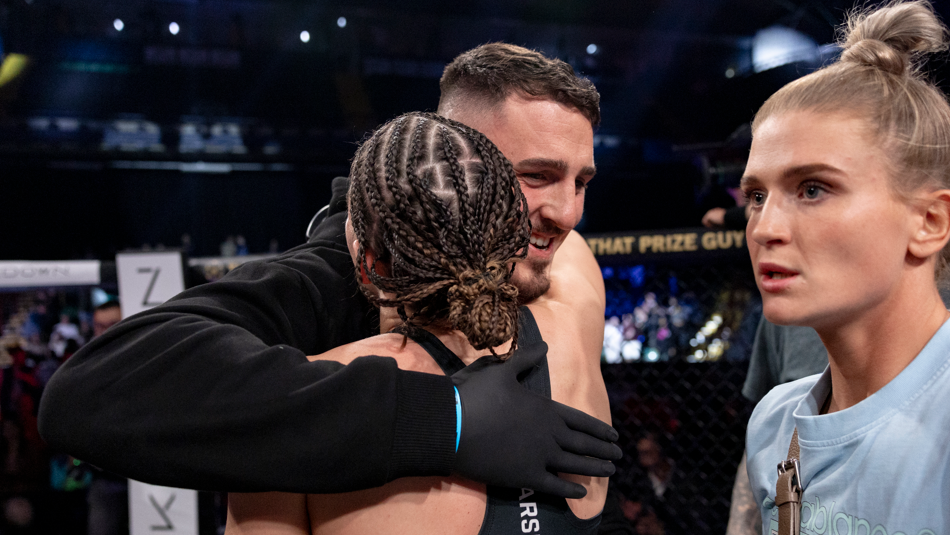 Savannah Marshall and Tom Aspinall embrace following Marshall's win over Mirela Vargas