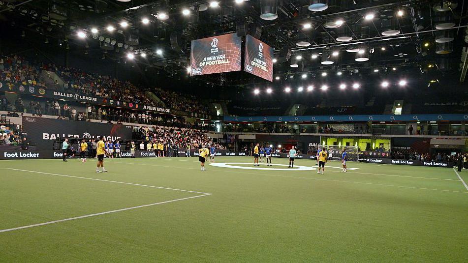 A wide view of an indoor football pitch