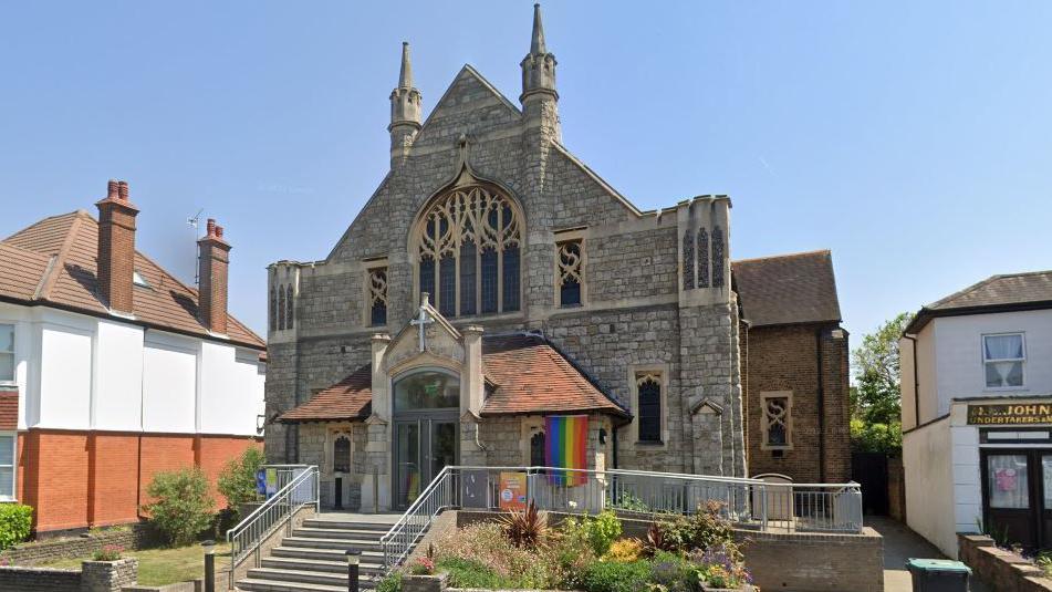 flag flying on the front of the church in Leigh 