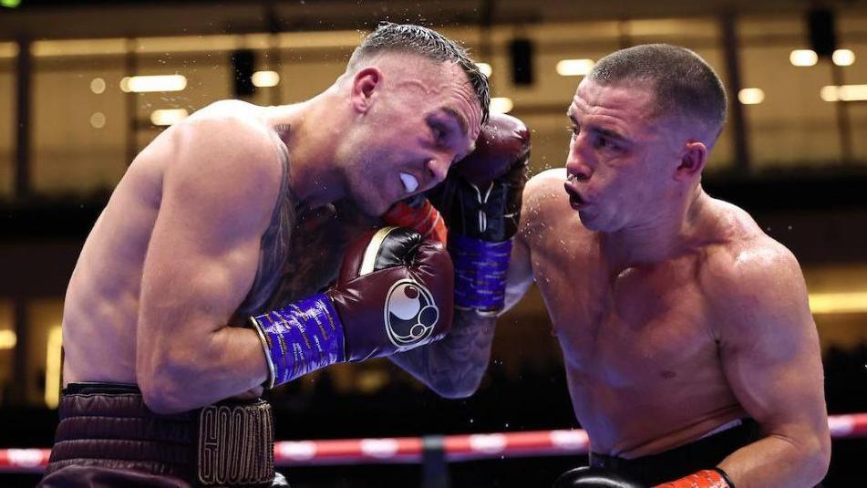 Nick Ball lands a punch on Sam Goodman