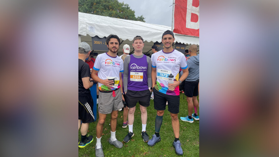 Three male runners standing in crowd at Robin Hood Half Marathon in Nottingham