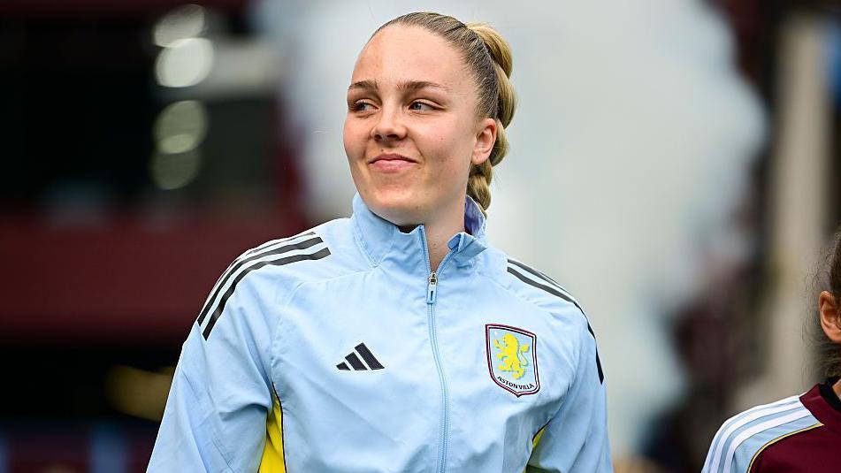 Ellie Roebuck wearing an Aston Villa jacket