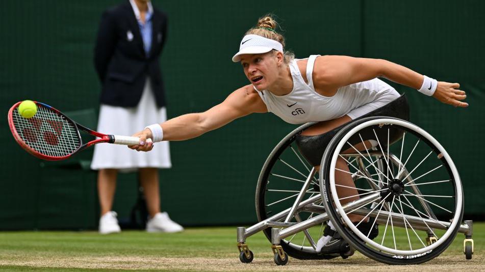 Wheelchair tennis player Diede de Groot plays a shot at Wimbledon