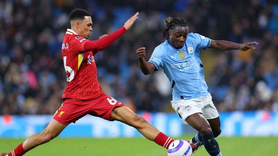 Manchester City winger Jeremy Doku tries to go past Liverpool's Trent Alexander-Arnold at the Etihad Stadium