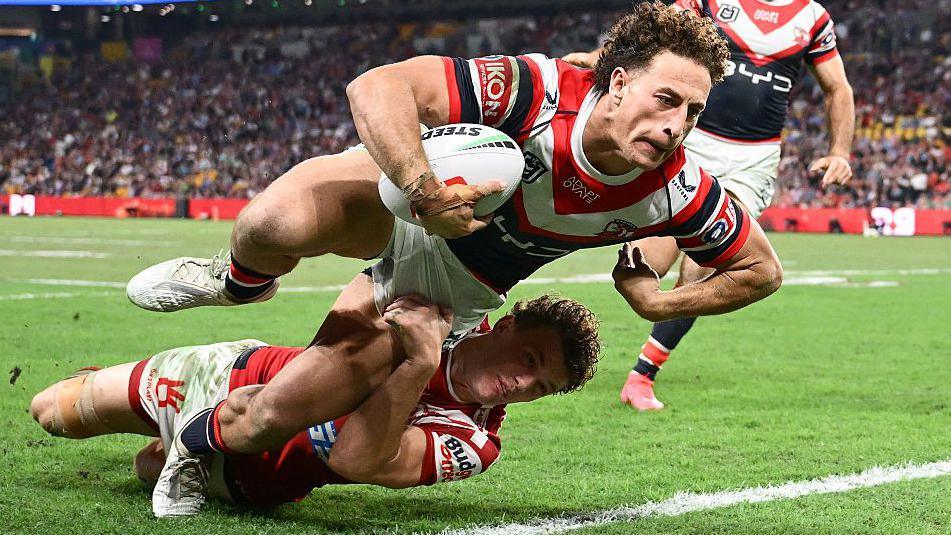 Mark Nawaqanitawase dives over