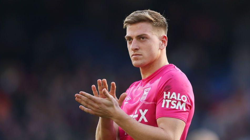 Ipswich forward Liam Delap applauds supporters following a Premier League game against Crystal Palace in 2024-25