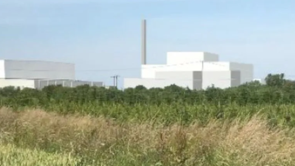 An artist's impression of the new incinerator shows square-shaped white buildings and a large chimney against blue sky. There is a grassed area in the forefront of the image