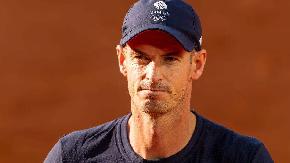 Andy Murray wearing a navy tv and navy Team GB cap