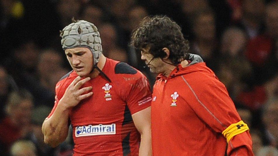 Jonathan Davies is helped off the field after being injured against South Africa