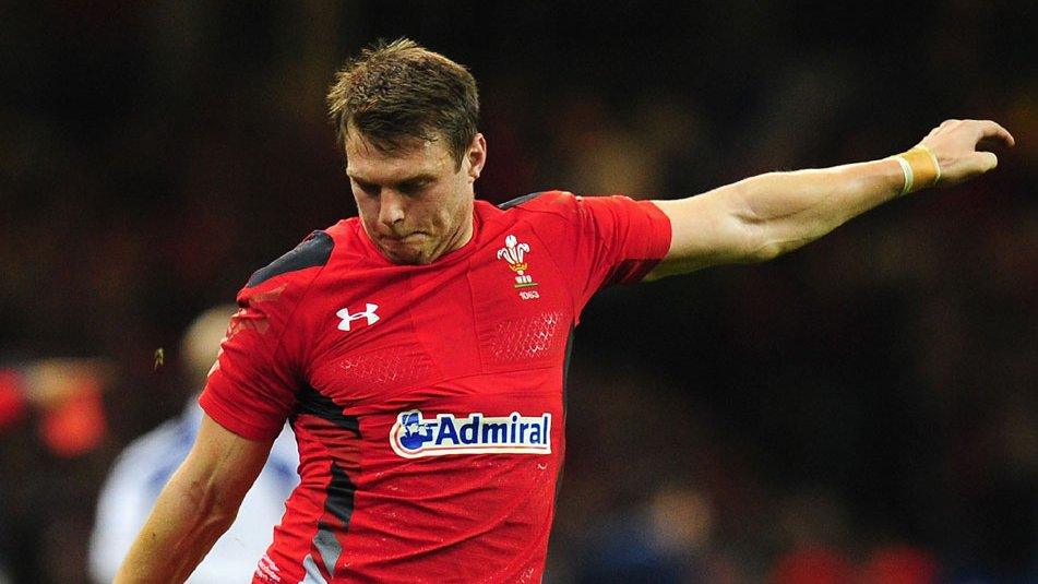 Dan Biggar kicks at goal for Wales