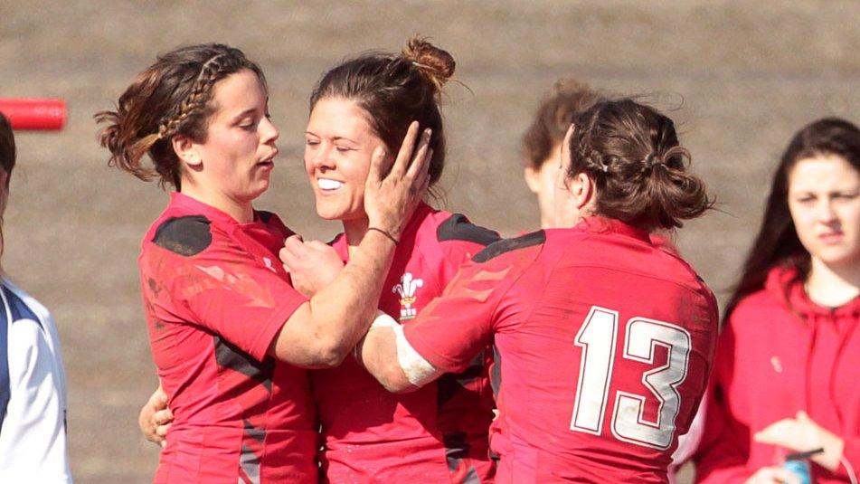 Welsh women celebrate a try against Scotland