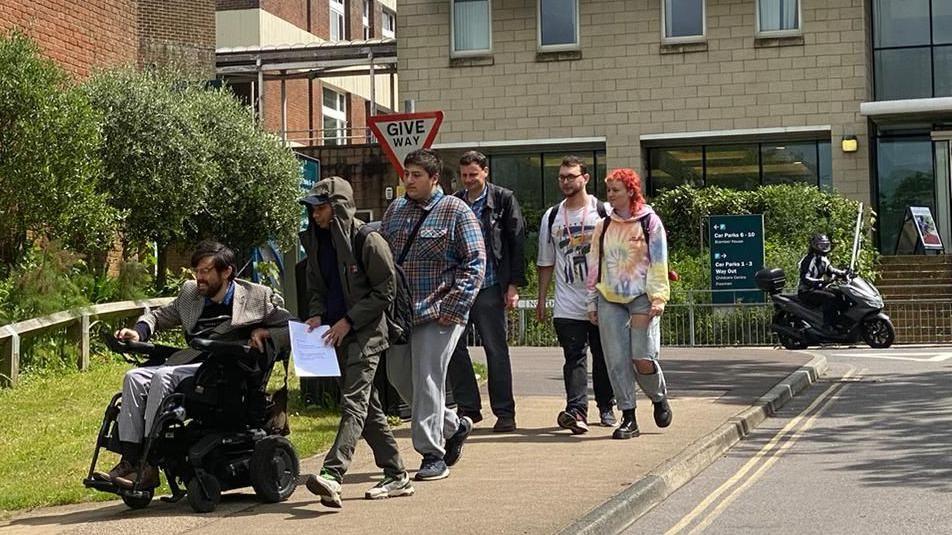 Students delivering a letter