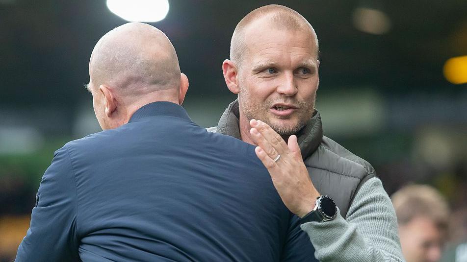 Liam Manning embraces Bristol City's Gerhard Struber at the final whistle