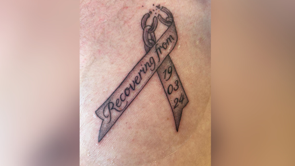 Tattoo on skin with words - recovering from 19/03/24.