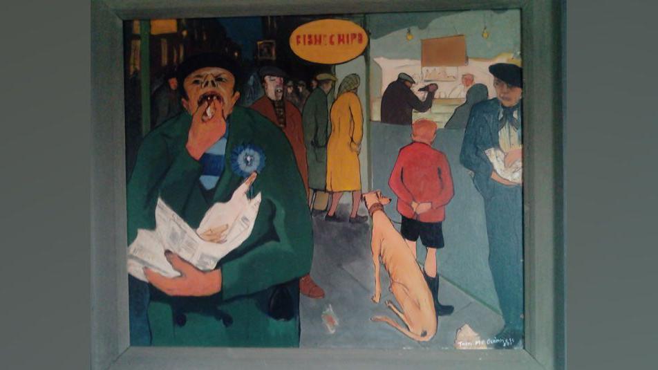 Fish and Chips by Tom McGuinness. It shows people queuing outside a fish and chip shop. A boy is waiting outside with a greyhound, while a man to his right is eating from a newspaper wrapper. To the left a man is eating fish and chips from a newspaper wrapper. He is wearing a green coat and has his nose pointed upwards revealing his nostrils.