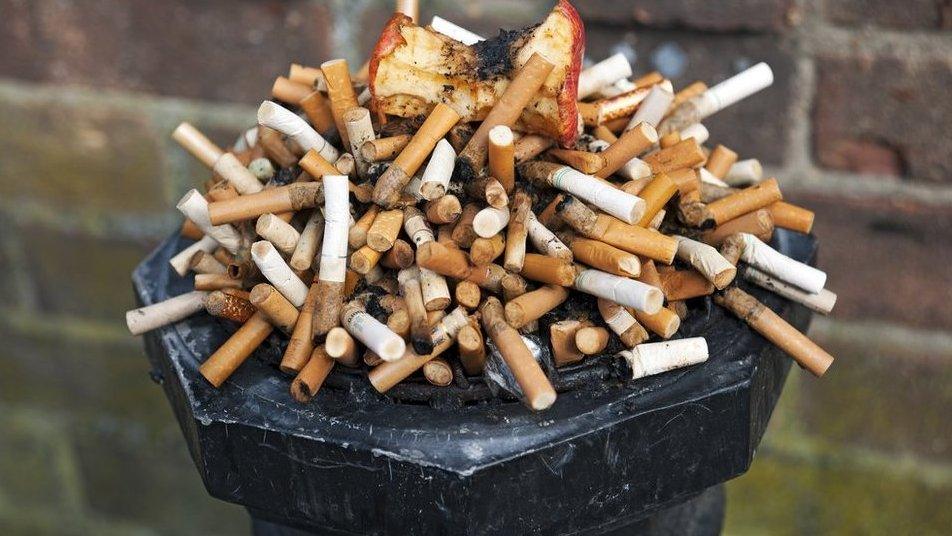 Picture of lots of cigarettes in an ashtray