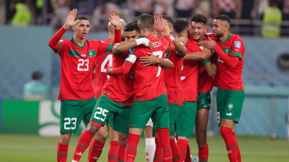 Morocco players celebrate a goal during the third-place play-off at the 2022 World Cup