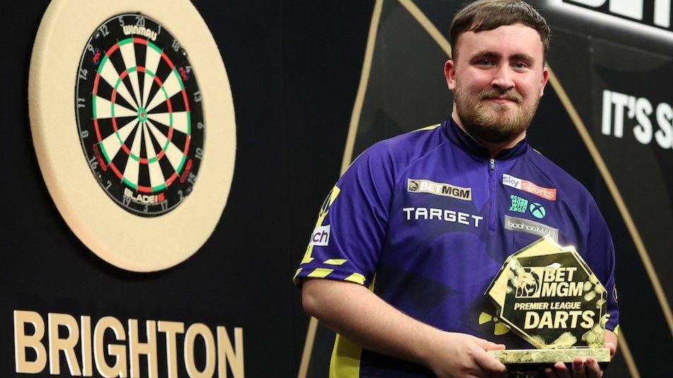 Luke Littler with the trophy after winning in Brighton