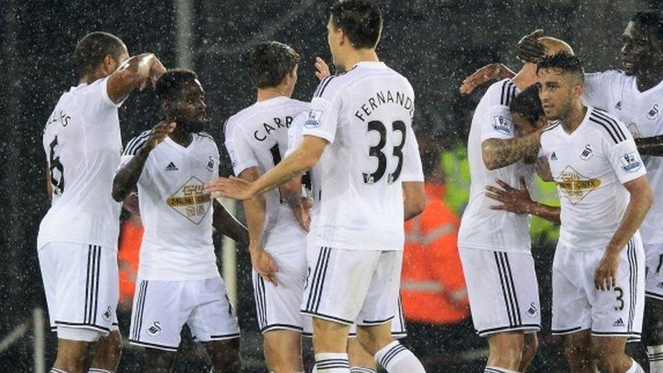 Swansea midfielder Nathan Dyer (second left) celebrates with team-mates