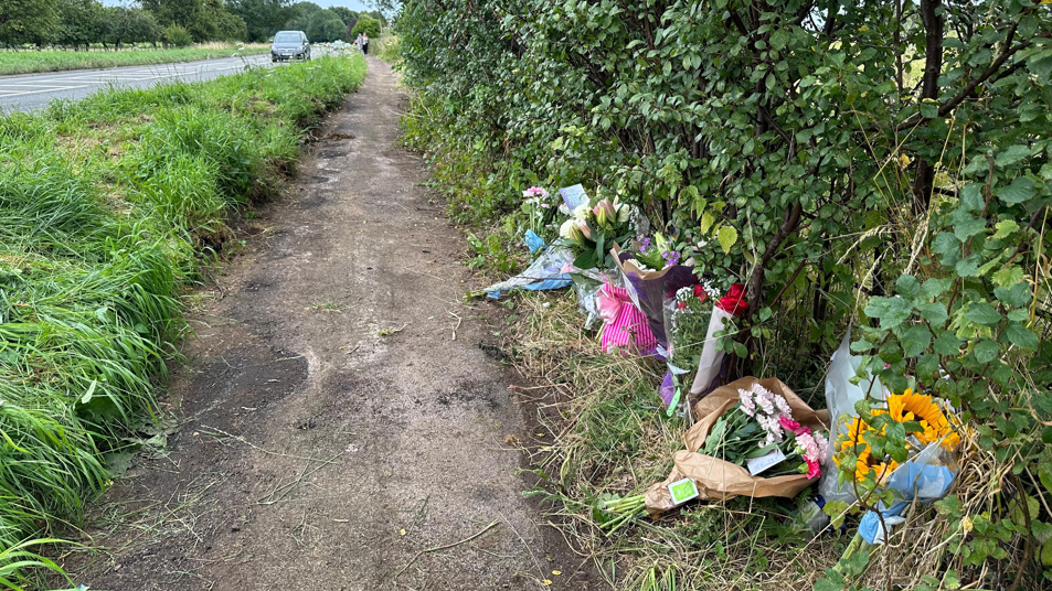 Flowers left at the scene of the crash