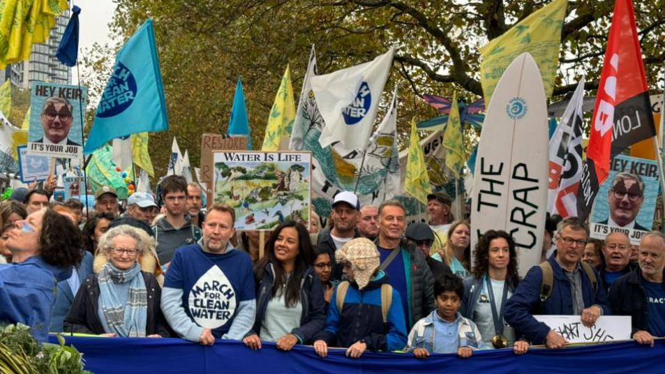 Protesters in London amid a sea of flags and banners