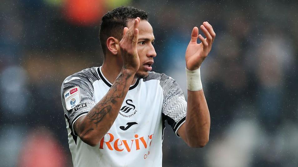 Ronald applauds during a Swansea game last season