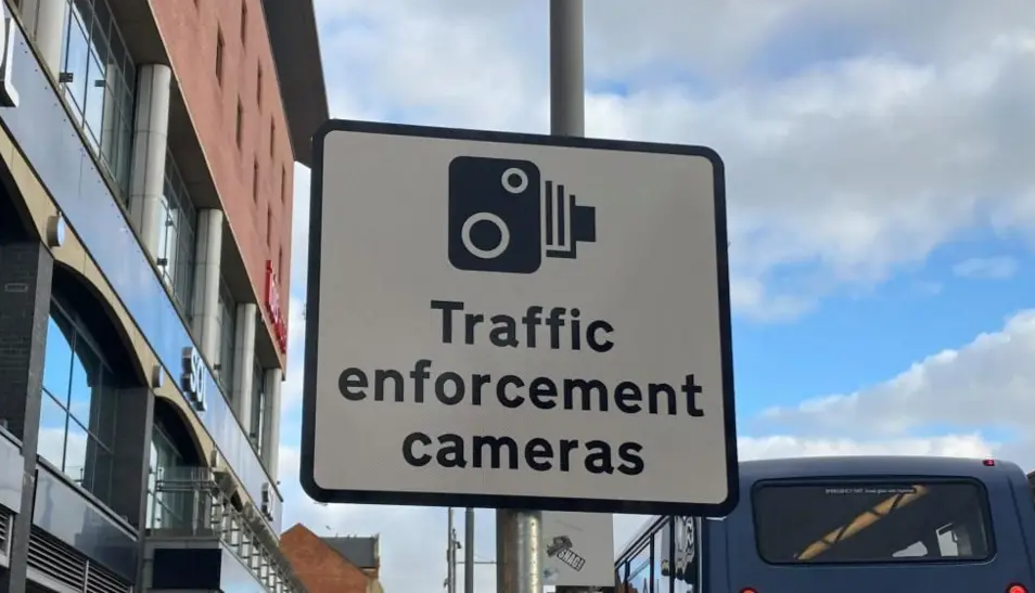 road sign saying "traffic enforcement cameras"