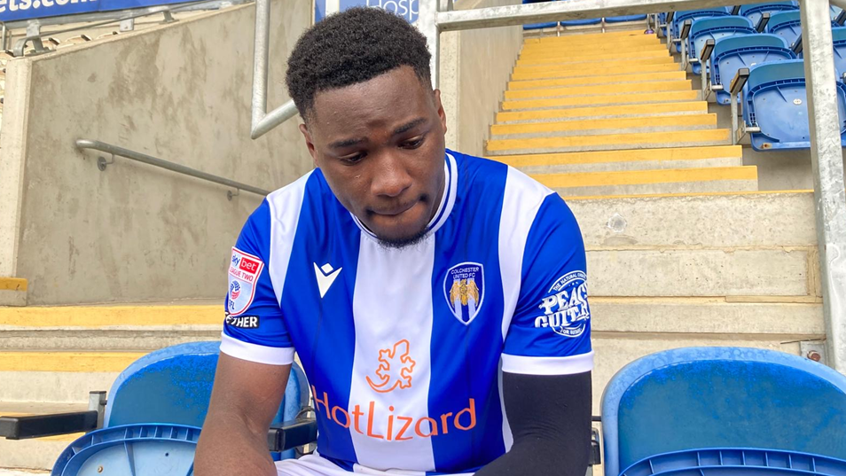 Samson Tovide in a blue Colchester United shirt