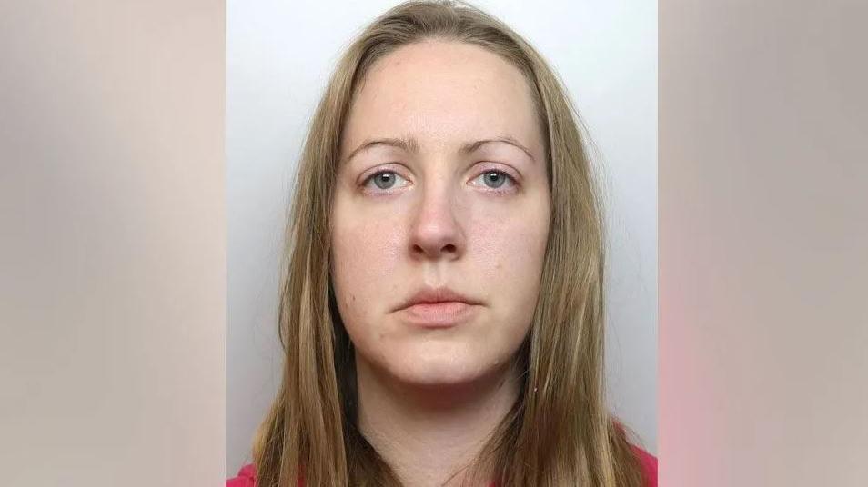 A police mugshot of Lucy Letby, who has straight blonde hair and stares into the camera with a blank expression