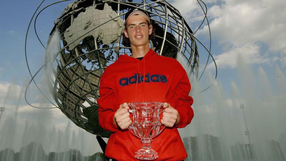 Andy Murray holds his 2004 US Open boys' trophy