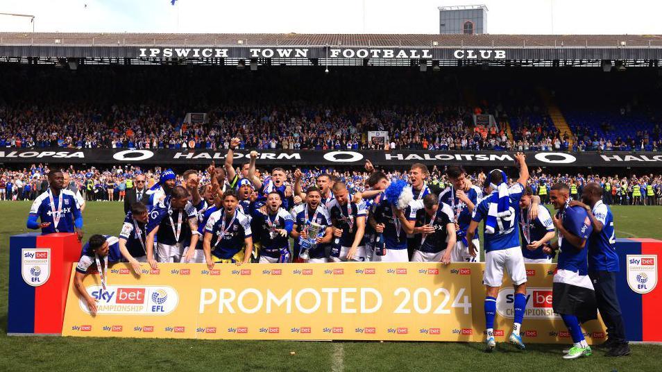 Ipswich Town players celebrate promotion from the Championship