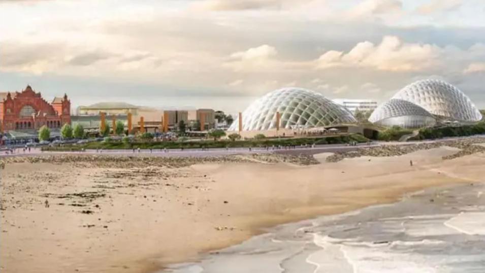 Artist impression of the Eden Project in Morecambe, showing the beach and sea overlooked by three large glass-domed pavilions shaped like shells