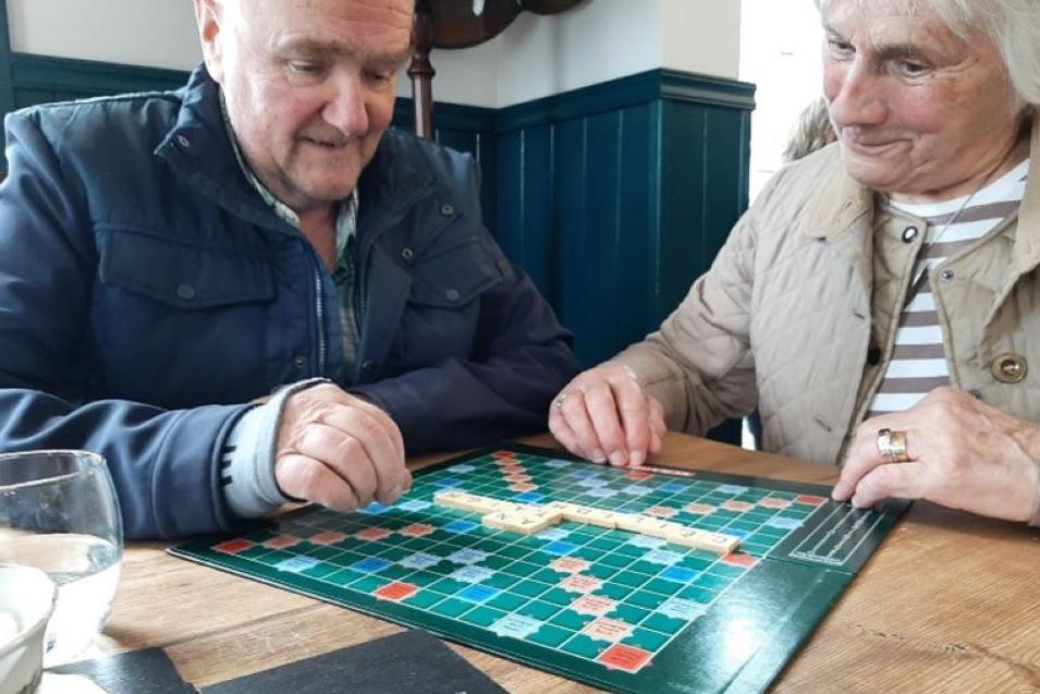 People playing Scrabble