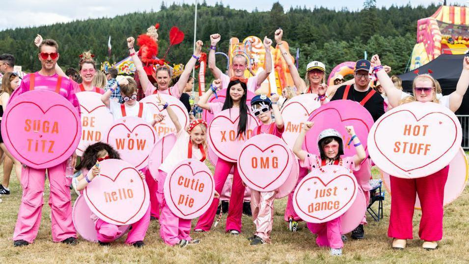 Festival-goers dressed as Love Heart sweets