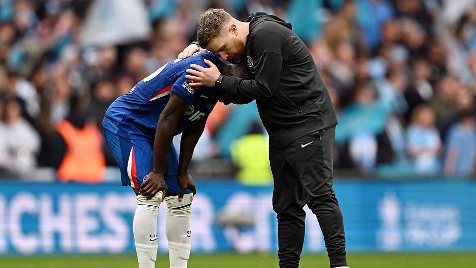 McFarlane hugs Caicedo after Wembley defeat
