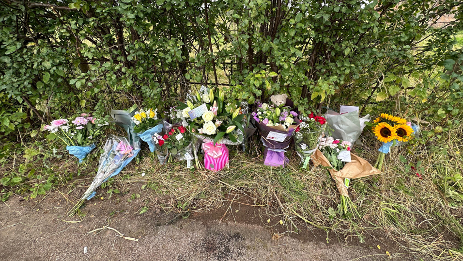 Flowers left at the scene of the crash