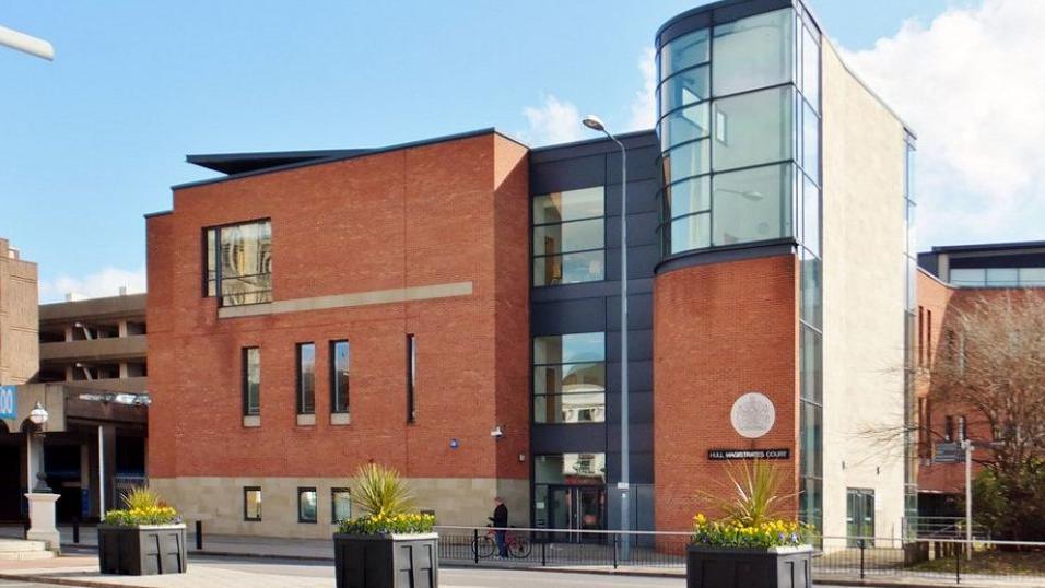 Hull Magistrates' Court, which is a mainly red brick building.