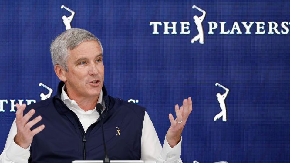 PGA Tour commissioner Jay Monahan gesticulates during a news conference at Sawgrass