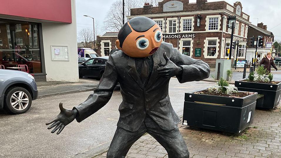 Frank Sidebottom statue on Stockport Street Road in Timperley, Greater Manchester.