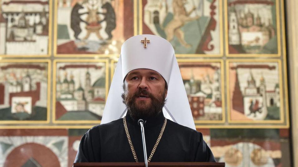 A man wearing Russian Orthodox clothing addresses the media following an extraordinary session of the Holy Synod of the Russian Orthodox Church in 2018
