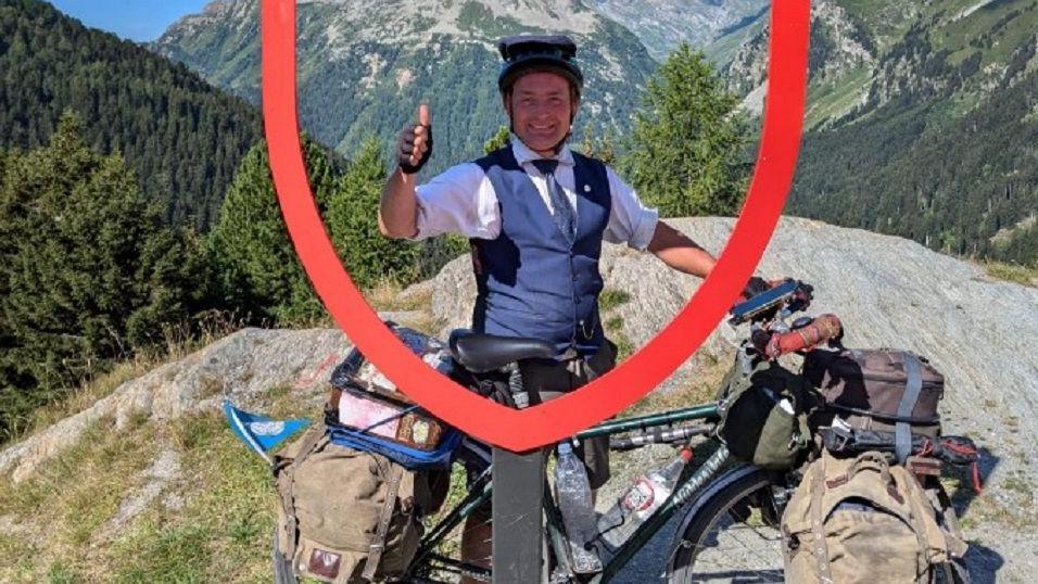 Mr Satloka pictured during his bike ride around Europe