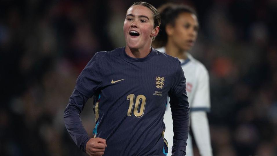 Grace Clinton celebrates scoring for England