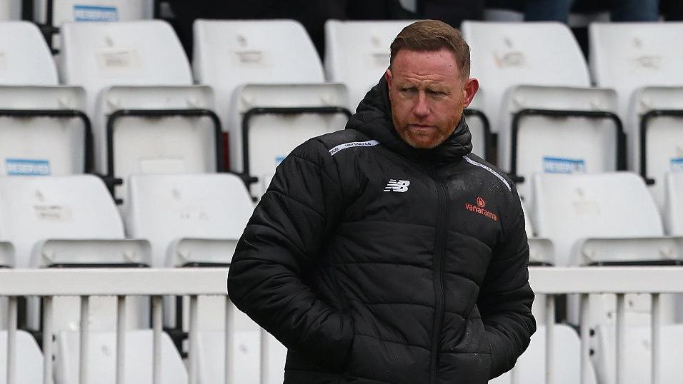 Manager Gavin Cowan on the touchline watching Brackley Town.