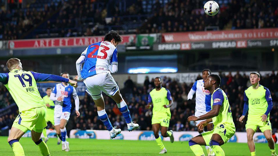 Yuki Ohashi leaps and heads the ball for Blackburn Rovers