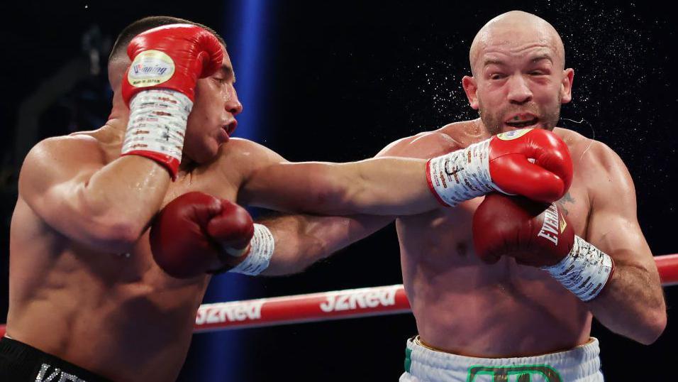 Nick Ball punches TJ Doheny on the chin